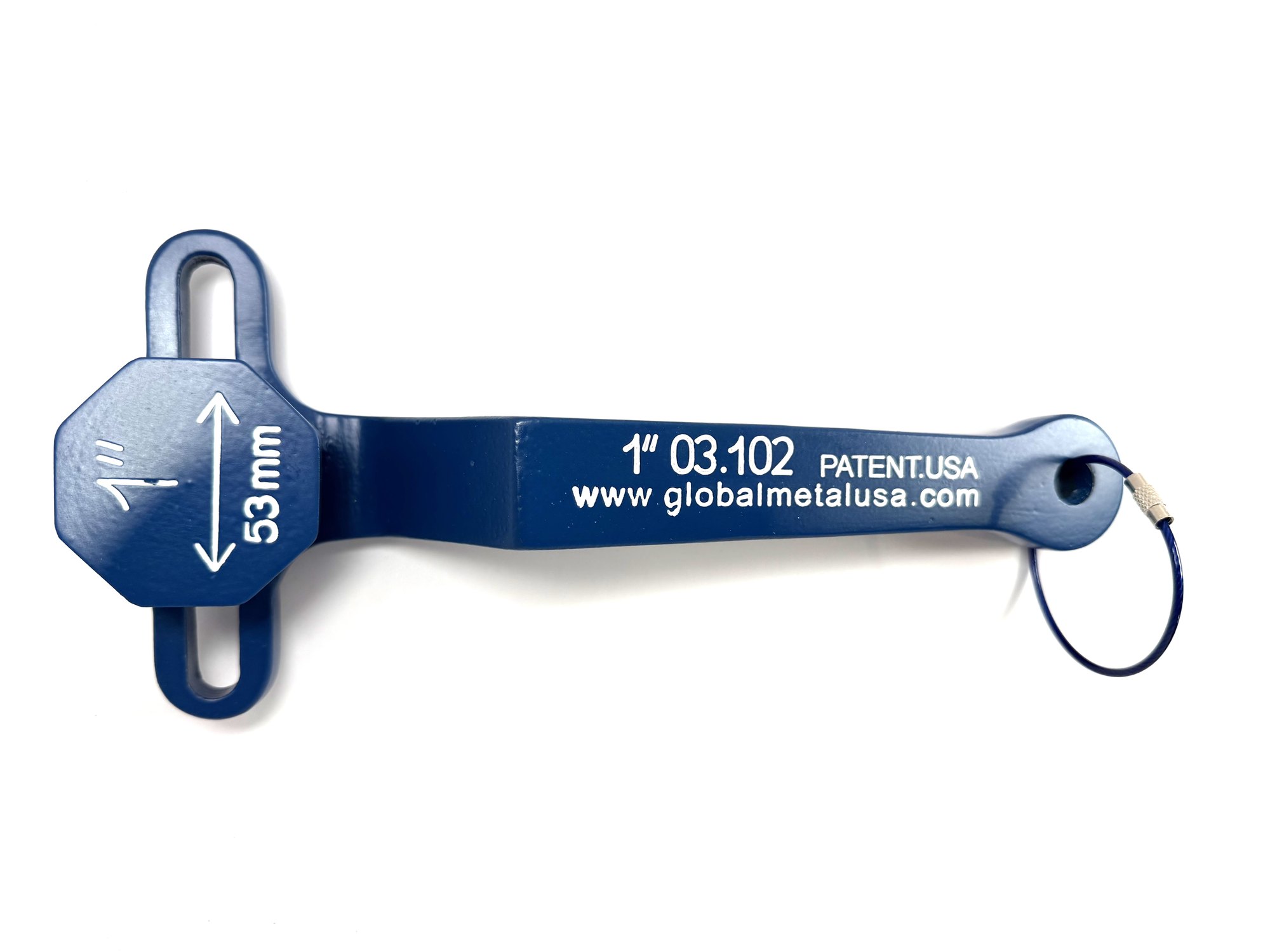 1-inch PVC ball valve frame wrench lying engraved side up on a white table with its key ring, item 03-102