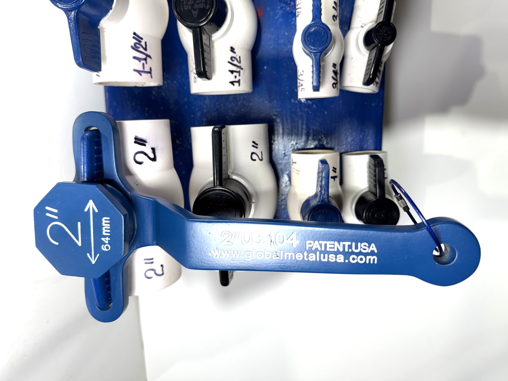 2-inch PVC ball valve frame wrench on a 2" blue-handle valve, wider view of the display board and other valves, item 03-104